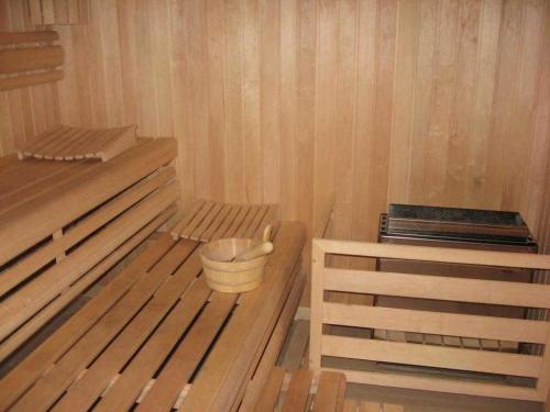 a corner of a sauna with a bucket in it at HP Touristik - Residenz Hohe Lith Neu 3 1 2 in Cuxhaven