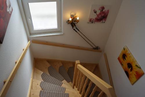 a room with a staircase with a window at Chalet Olympia in Neustift im Stubaital