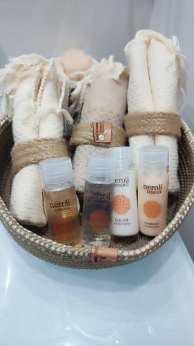 a basket filled with towels and other items at Ideal Appart El Wahat VIP in El Aouina