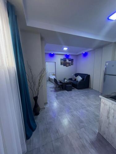 a living room with a couch and a table at MODERN AND COMFORTABLE APARTMENT Self Check In in Yerevan