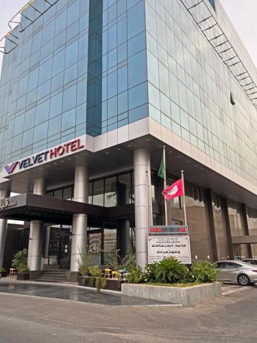 a building with a car parked in front of it at Velvet Hotel Jeddah in Jeddah
