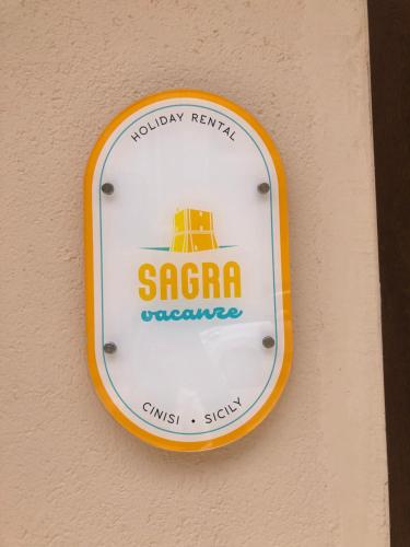a sign for a sa agency hanging on a wall at Sagra Vacanze Cinisi in Cinisi