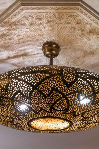 a chandelier hanging from a ceiling in a room at Villa Oasis Galé - Luxury Villa with private pool, AC, free wifi, 5 min from the beach in Albufeira