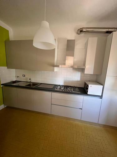Kuchyň nebo kuchyňský kout v ubytování Casa Le Grazie