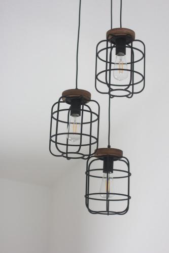 a group of three lights hanging from a ceiling at BNB Klinga in Klinga