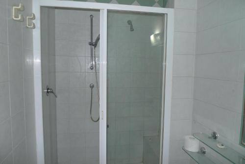 a shower with a glass door in a bathroom at B&B Ai Prati in Bergamo