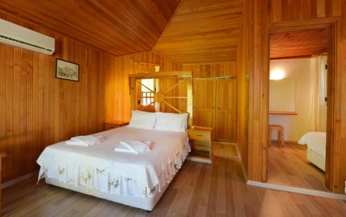 Postel nebo postele na pokoji v ubytování Arcadia Hotel