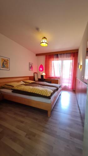 Un ou plusieurs lits dans un hébergement de l'établissement Atina Hotel