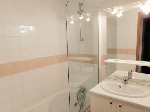 a bathroom with a sink and a shower at Appartement Morillon 1100, 3 pièces, 6 personnes - FR-1-412-5 in Morillon