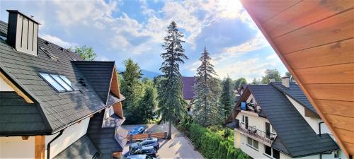 an overhead view of the roofs of two buildings at VIP APARTAMENTY Chałubińskiego APART in Zakopane