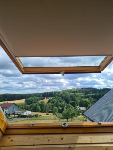 a skylight window in the roof of a house at Pensionszimmer Larifari in Drees