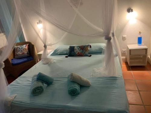 Cama o camas de una habitación en LeLagon Vue Mer, Pieds dans l'eau