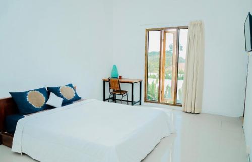 Postel nebo postele na pokoji v ubytování The Baladewa