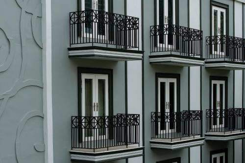 a building with balconies on the side of it at La Petite Salil Sukhumvit Thonglor 1 in Bangkok