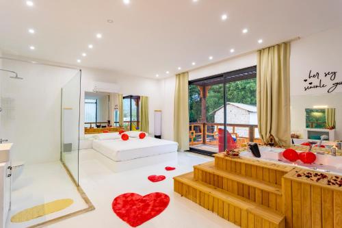 a bathroom with two red hearts on the floor at Lara Uno- Muhafazakar Balayı Villası in Çayköy