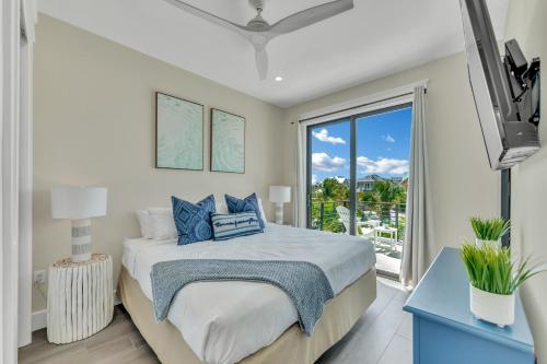 a bedroom with a bed and a large window at Shore Thing in Sarasota