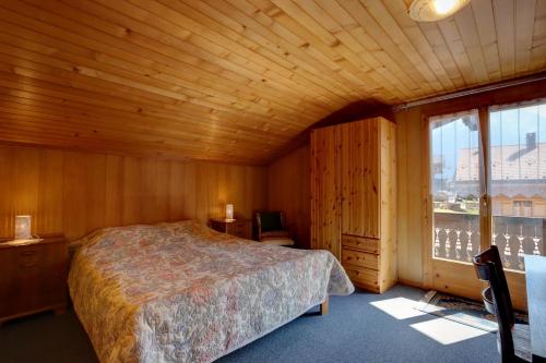En eller flere senger på et rom på Appartement Les Cascades