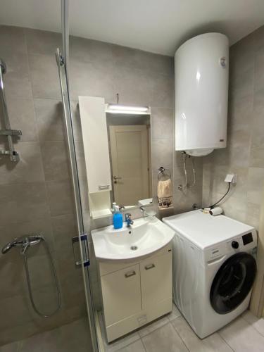 a bathroom with a washing machine and a sink at HAMAM in Novi Pazar