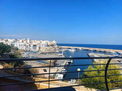 a view of a harbor with a city and the ocean at Atico dúplex en Ametlla de Mar in L'Ametlla de Mar