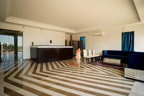 a small child standing in a living room at 1st Luxury in Rāmdevra