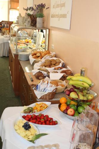 a buffet with many different types of fruits and vegetables at Hotel Goldener Hirsch in Suhl