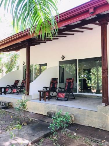 a group of chairs sitting on a patio at La Dolce Vita in Sigiriya