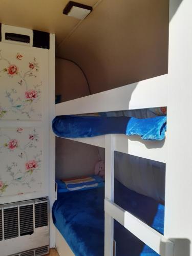 a bunk bed room with two bunk beds at Mary 's Retro Caravan in Eratini