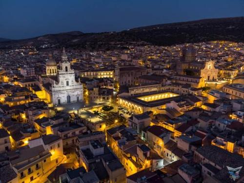 an aerial view of a city at night at Filuvespri in Comiso