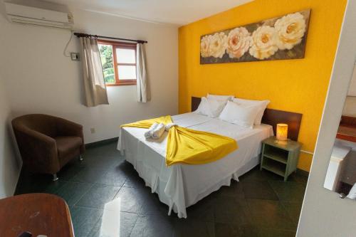 A bed or beds in a room at Pousada Céu de Estrelas