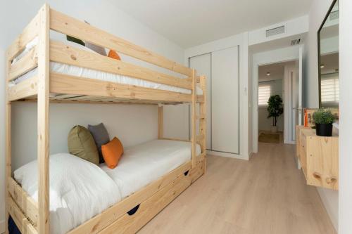 Posteľ alebo postele v izbe v ubytovaní Apartamento de lujo de dos dormitorios