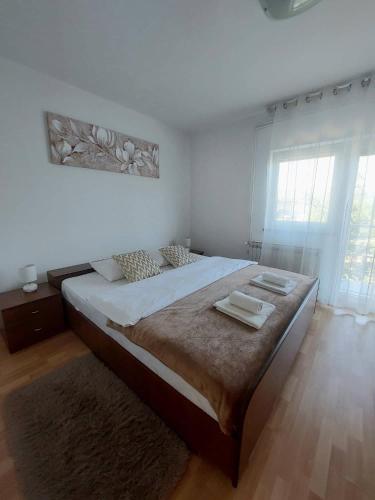 a bedroom with a large bed in a room at Dream in Otočac