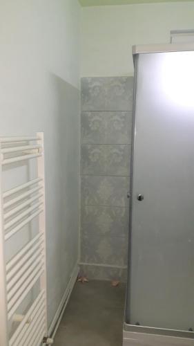 a white closet with a door in a room at Cozy, central 1-bedroom apartment in Timisoara, Romania in Timişoara
