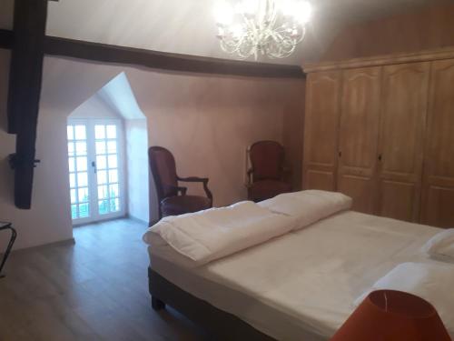 Posteľ alebo postele v izbe v ubytovaní Grand gîte au château de Betz-le-Château