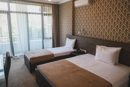 Old Garden Hotel Batumiにあるベッド