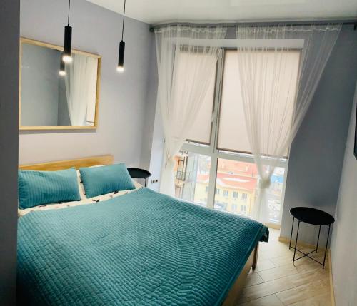 Ένα ή περισσότερα κρεβάτια σε δωμάτιο στο Яровиця 13