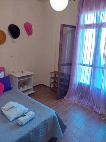 Ένα ή περισσότερα κρεβάτια σε δωμάτιο στο Eftihia's Home
