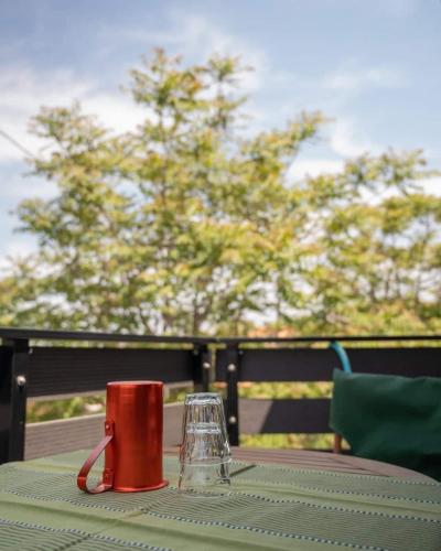 a red coffee mug sitting on a table at Dioni Stone House in Petrokefalo