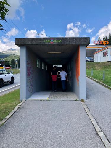 a tunnel with two people standing in it at Rancho Laaxdeluxe in Laax