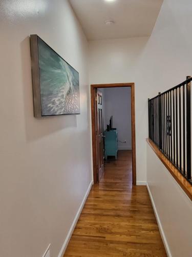 a hallway of a home with a painting on the wall at Reservoir Hill Mansion - 4 bedrooms in Baltimore