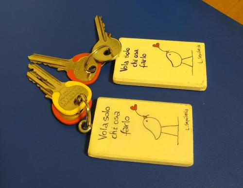 two pairs of scissors sitting on top of a table at Appartamento Da Castlin in Fano