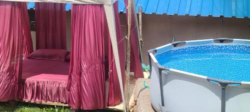 a hot tub with a table and a chair next to it at Vila Medo in Brdo