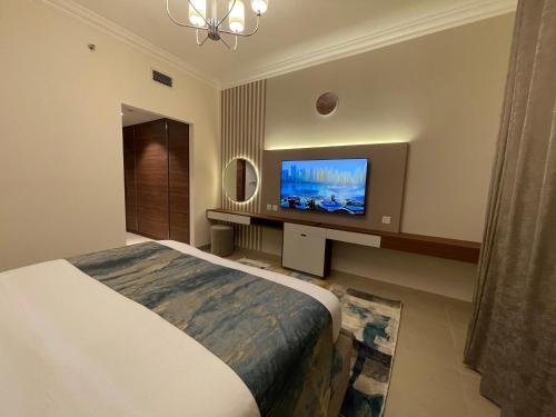 Телевизор и/или развлекательный центр в GOODWOOD SUITES HOMES VACATION