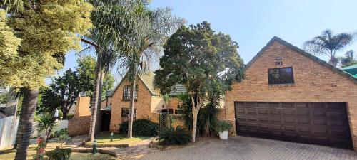 a large brick house with a garage at Sanctuary on Lois - under 1km from hospital - load shedding free in Pretoria