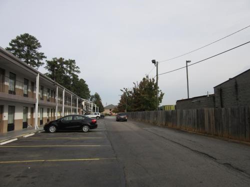 a car parked in a parking lot next to a building at Heritage Inn Augusta in Augusta