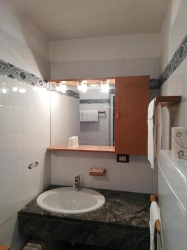 a bathroom with a sink and a mirror at Residence Pavou in Cogne
