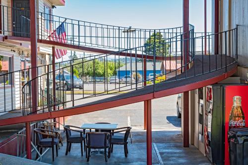 a staircase in a building with chairs and a table at Riviera Inn in Port Angeles
