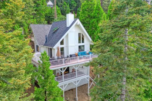 an aerial view of a house in the woods at Love It Up Here! at Lake Arrowhead Lakeview 5 bedrooms 2 lofts 4 decks in Lake Arrowhead