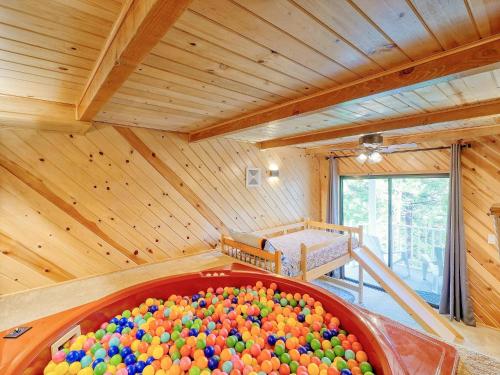 a large tub filled with balls in a room at Kid's Paradise! Ball Pit 2 Lofts Lakeview 5 bd, 3ba in Lake Arrowhead