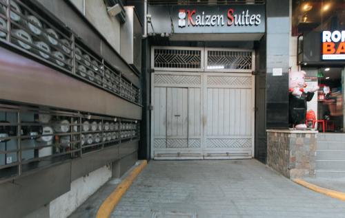 a store with two large doors in a building at RedDoorz Plus @ Kaizen Suites Taft Avenue in Manila