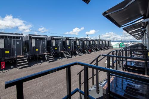 a row of train cars parked on a pier at HOTEL R9 The Yard Miyakonojo in Miyakonozyō